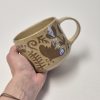 Ceramic sgraffito mug in brown