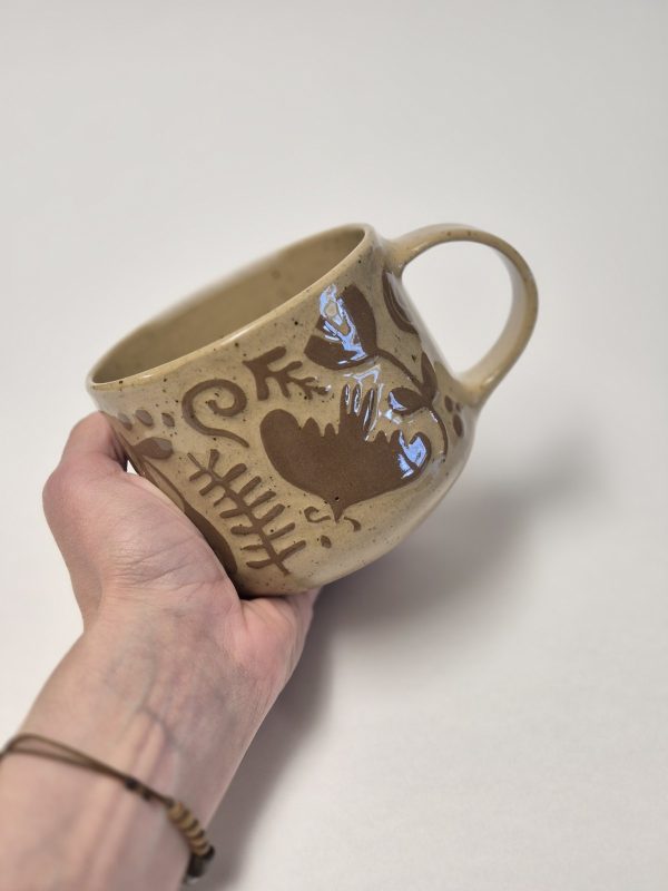 Ceramic sgraffito mug in brown