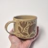 Ceramic sgraffito mug in brown