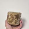 Ceramic sgraffito mug in brown