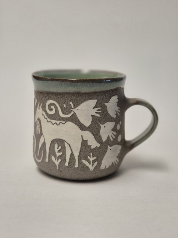 Ceramic sgraffito mug with horses