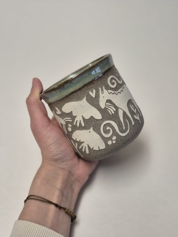 Ceramic sgraffito mug with horses