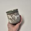 Ceramic sgraffito mug with horses