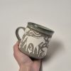 Ceramic sgraffito mug with horses