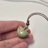 Tiny bird pendant
