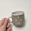 Coffee cup with hearts